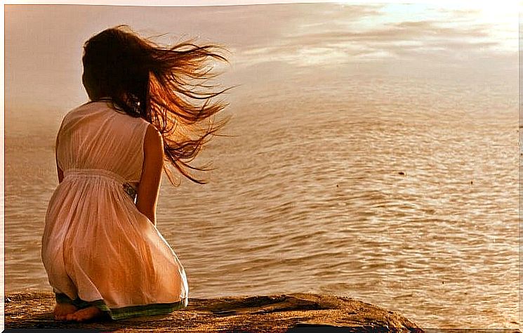 Girl in front of ocean