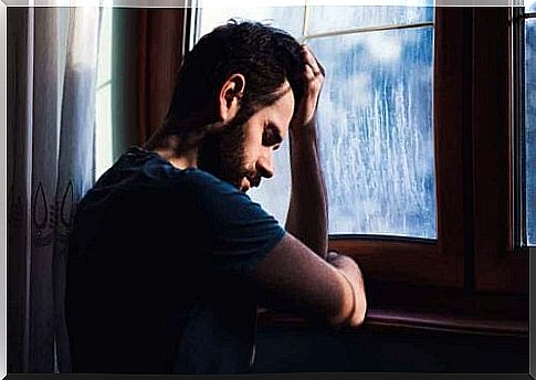 Depressed man at the window