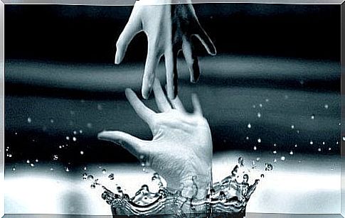 hands-touching-in-water