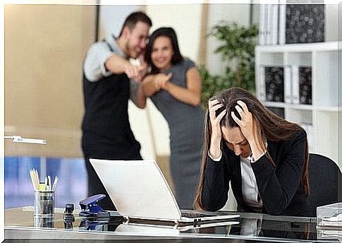 Toxic co-workers mocking another co-worker