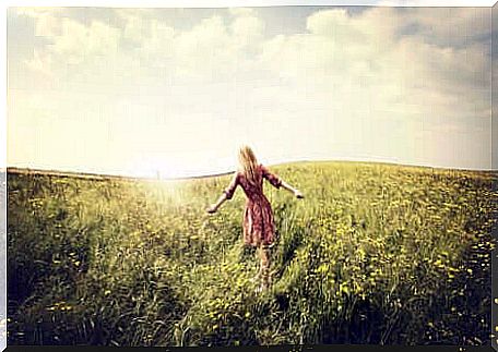 Woman in the middle of a field.