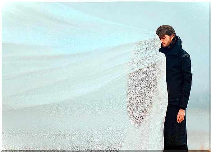 man-in-front-of-a-woman-with-white-veil