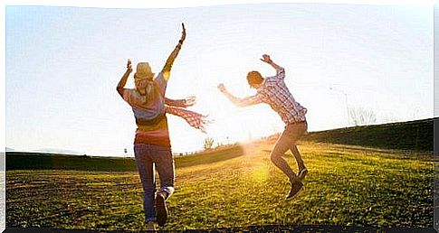 Couple running and jumping