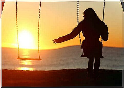 Lonely woman on the swing at sunset who wants to find a partner