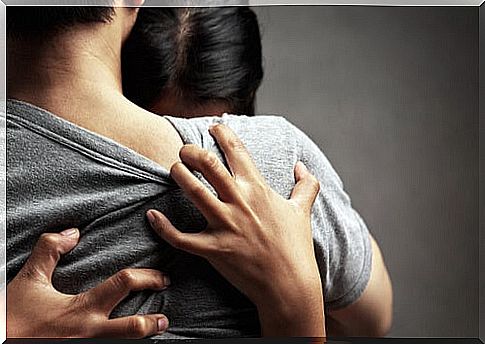 Woman embraced to partner