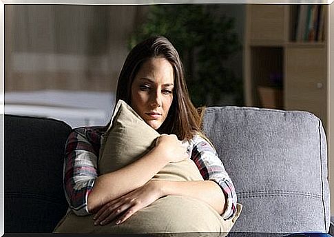 Girl hugs pillow to control anger