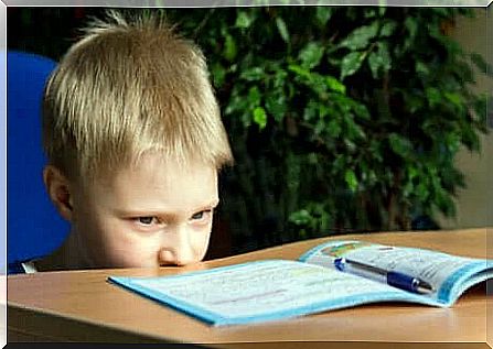 Hyperactive child with homework book.