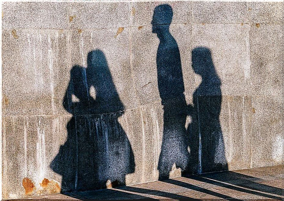 Shadows on the wall of a group of people