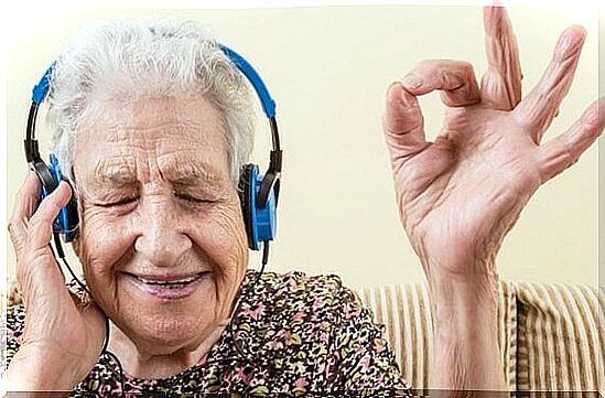 Old woman listening to music