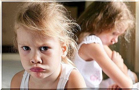 Little girl angry with other little girl.