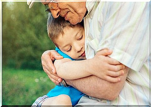 Grandfather hugging his grandson