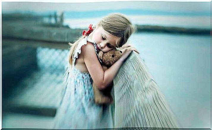 scars little girl on the bridge hugs stuffed teddy bear