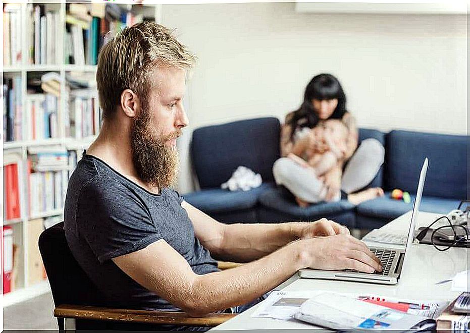 man at pc pays no attention to wife and child